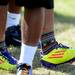 A Lincoln football player shows off his colorful socks and shoes during practice at the school on Wednesday, August 14, 2013. Melanie Maxwell | AnnArbor.com